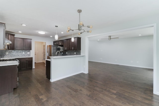 1406 Woodbine Rd Unit 1, Bloomington, IL 61704 - kitchen featuring stainless steel appliances, dark brown cabinetry, decorative backsplash, recessed lighting, and open floor plan