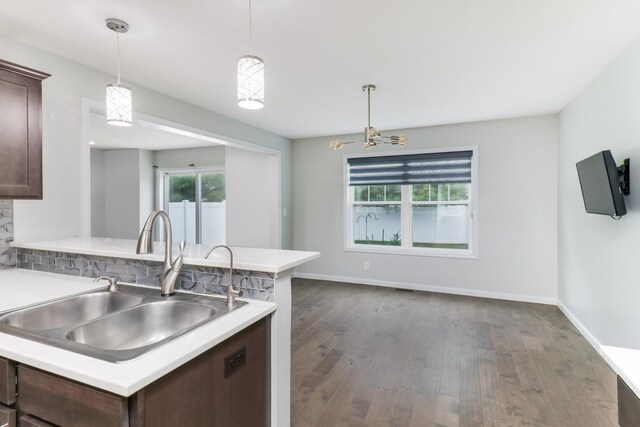 1406 Woodbine Rd Unit 1, Bloomington, IL 61704 - kitchen featuring a sink, dark wood-style flooring, healthy amount of natural light, and dark brown cabinetry