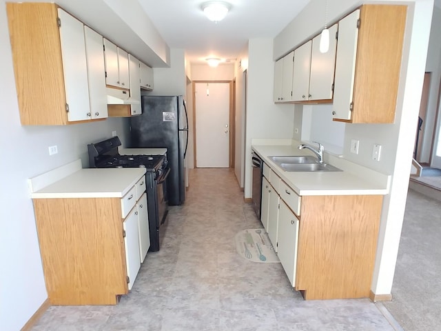 202 Teak Ln, Streamwood, IL 60107 - kitchen with black gas stove, light floors, a sink, stainless steel dishwasher, and under cabinet range hood