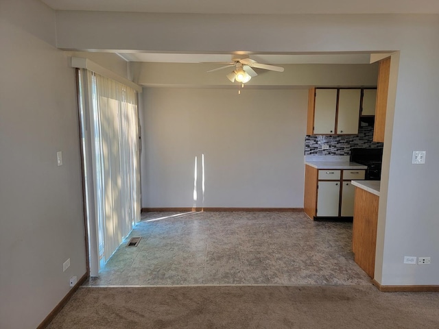 202 Teak Ln, Streamwood, IL 60107 - kitchen with plenty of natural light, light countertops, ceiling fan, and tasteful backsplash