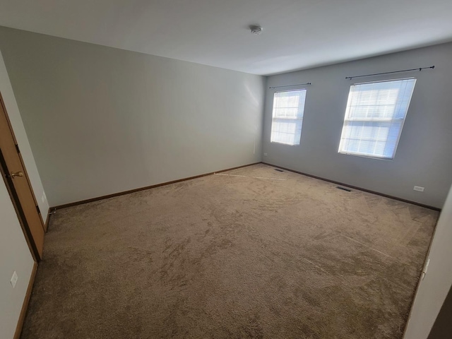 202 Teak Ln, Streamwood, IL 60107 - unfurnished room featuring light colored carpet and a smoke detector