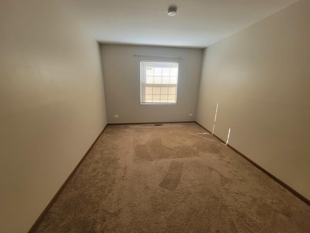 202 Teak Ln, Streamwood, IL 60107 - carpeted empty room with baseboards and a smoke detector