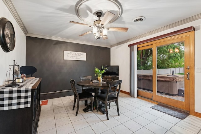 912 Murphy Dr, Joliet, IL 60435 - dining area featuring a ceiling fan, light tile patterned floors, crown molding, and baseboards