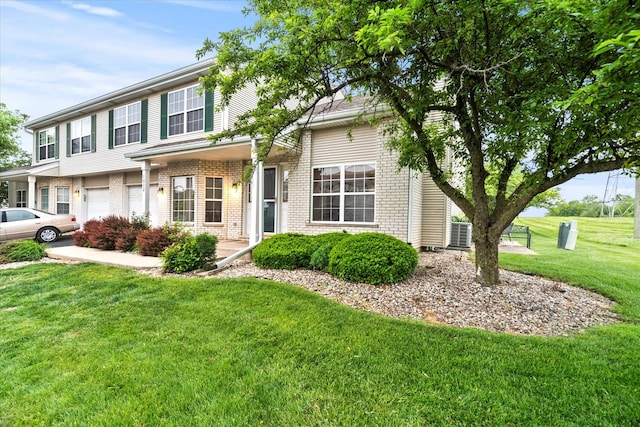1412 Root St, Crest Hill, IL 60403 - view of front of property featuring an attached garage, a front lawn, and brick siding