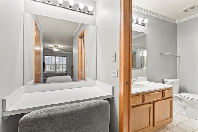 1412 Root St, Crest Hill, IL 60403 - ensuite bathroom featuring vanity, crown molding, toilet, tile patterned flooring, and ceiling fan