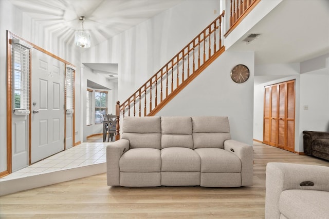 1412 Root St, Crest Hill, IL 60403 - foyer entrance with stairway, wood finished floors, and a towering ceiling