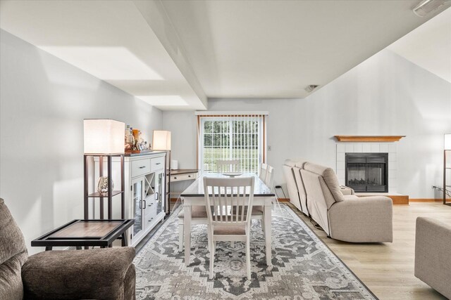 1412 Root St, Crest Hill, IL 60403 - dining space featuring wood finished floors, a fireplace, and baseboards