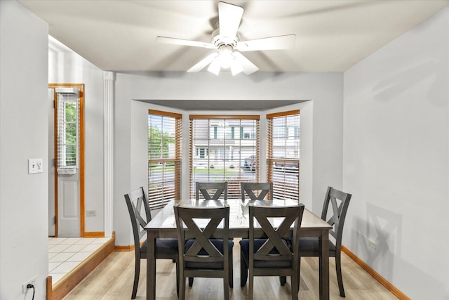 1412 Root St, Crest Hill, IL 60403 - dining room featuring plenty of natural light, light wood finished floors, a ceiling fan, and baseboards