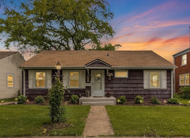 9532 Lexington Ave, Brookfield, IL 60513 - bungalow-style house featuring a front lawn and roof with shingles