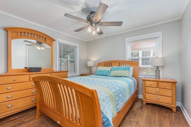 9532 Lexington Ave, Brookfield, IL 60513 - bedroom featuring multiple windows, wood finished floors, crown molding, baseboards, and a ceiling fan