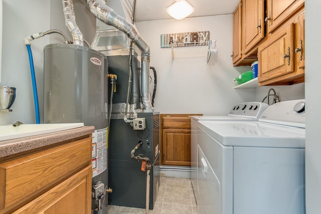 9532 Lexington Ave, Brookfield, IL 60513 - laundry room with washing machine and dryer, cabinet space, and gas water heater
