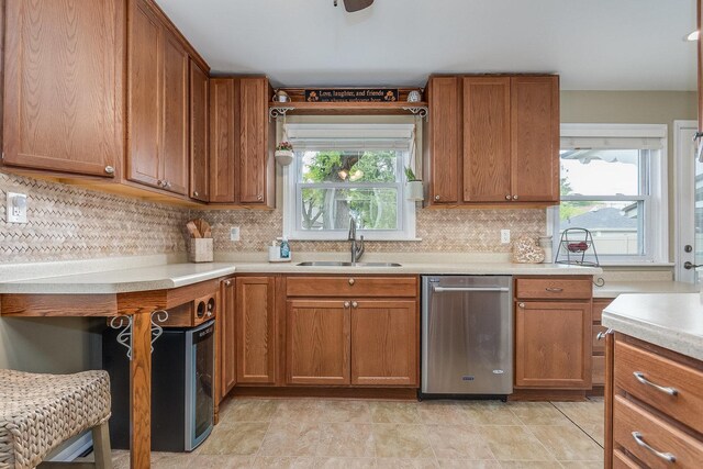 9532 Lexington Ave, Brookfield, IL 60513 - kitchen featuring dishwasher, a sink, brown cabinets, and light countertops