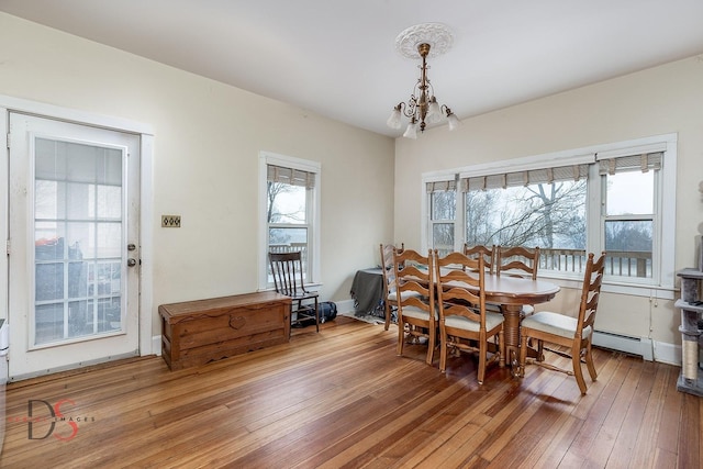 22386 N 3400 E Rd, Emington, IL 60934 - dining room with plenty of natural light, a chandelier, hardwood / wood-style flooring, and a baseboard radiator