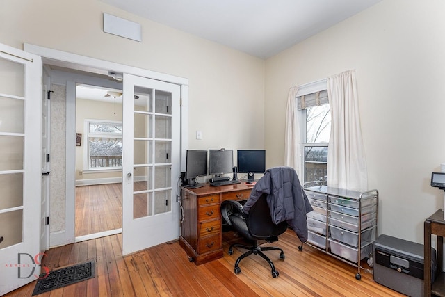 22386 N 3400 E Rd, Emington, IL 60934 - office area featuring french doors, hardwood / wood-style flooring, healthy amount of natural light, and baseboards