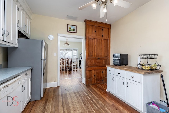 22386 N 3400 E Rd, Emington, IL 60934 - kitchen featuring white dishwasher, a chandelier, dark wood-type flooring, white cabinetry, and freestanding refrigerator