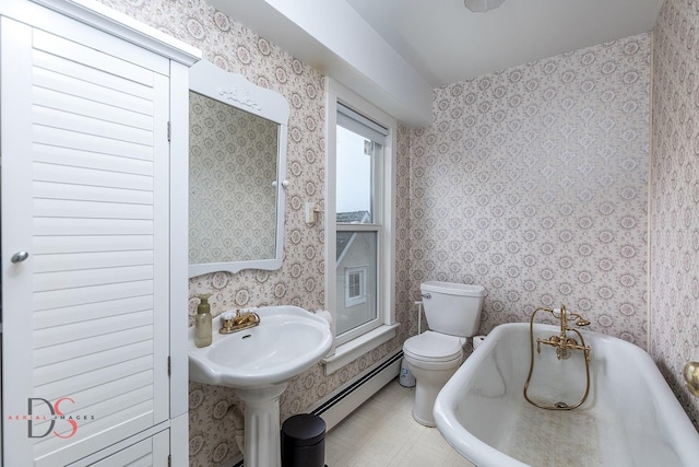 22386 N 3400 E Rd, Emington, IL 60934 - full bath with baseboard heating, a tub, toilet, and wallpapered walls