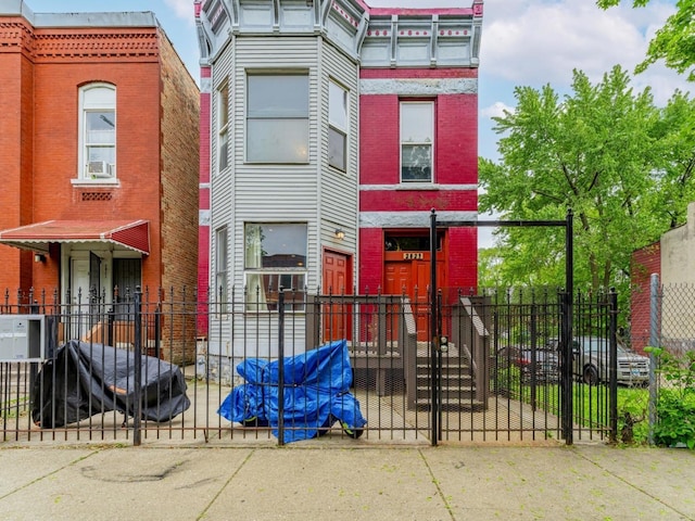 2823 W Flournoy St, Chicago, IL 60612 - view of front of property with brick siding and a fenced front yard