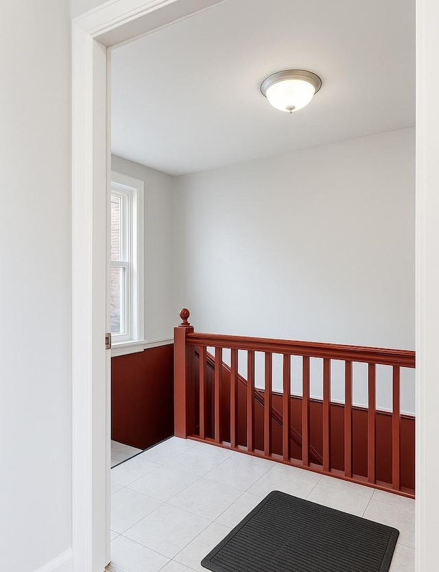 2823 W Flournoy St, Chicago, IL 60612 - hallway with light tile patterned floors and an upstairs landing