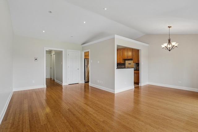 11114 Heritage Dr Unit 3C, Palos Hills, IL 60465 - unfurnished living room with a chandelier, lofted ceiling, light wood-style floors, and baseboards