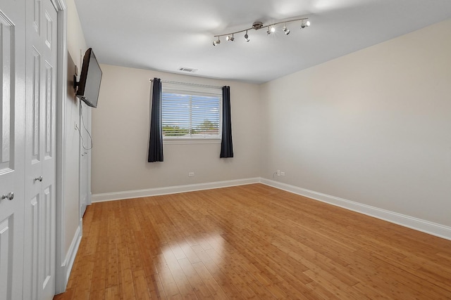 11114 Heritage Dr Unit 3C, Palos Hills, IL 60465 - unfurnished bedroom with baseboards, light wood-type flooring, and a closet