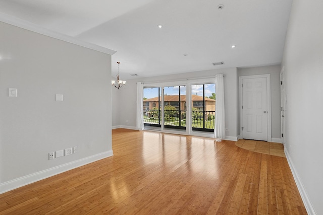 11114 Heritage Dr Unit 3C, Palos Hills, IL 60465 - spare room featuring a chandelier, light wood-style floors, baseboards, and recessed lighting