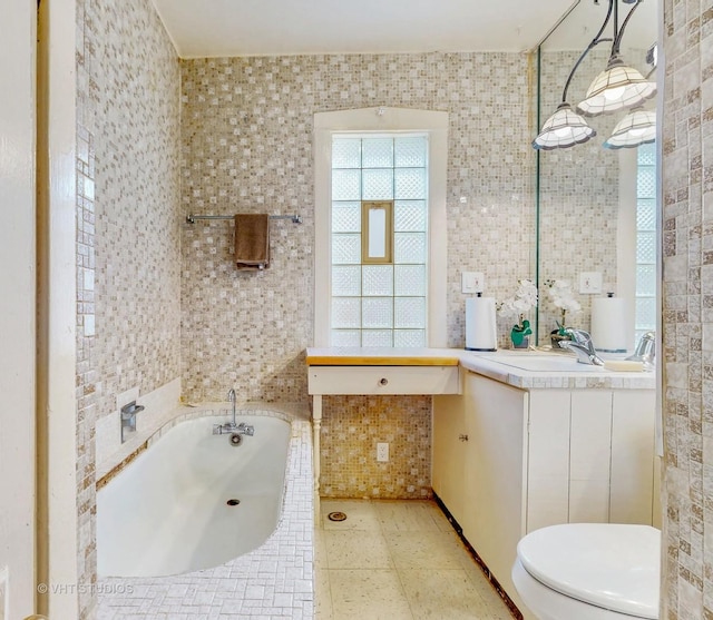 7832 S Paxton Ave, Chicago, IL 60649 - bathroom with a bath, vanity, and tile walls