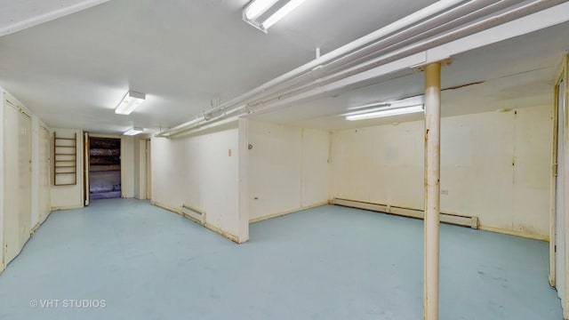 7832 S Paxton Ave, Chicago, IL 60649 - unfinished below grade area with a baseboard radiator