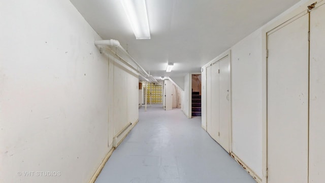 7832 S Paxton Ave, Chicago, IL 60649 - corridor featuring concrete flooring and stairs