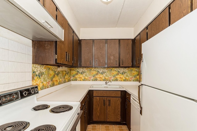 1301 N Western Ave Unit 236, Lake Forest, IL 60045 - kitchen featuring white appliances, ventilation hood, light countertops, and backsplash