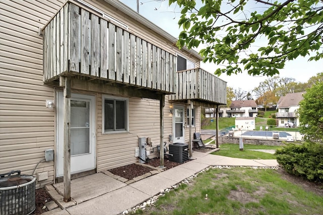 126 Cora Ave Unit D, Fox Lake, IL 60020 - view of patio with central air condition unit, a balcony, and a residential view