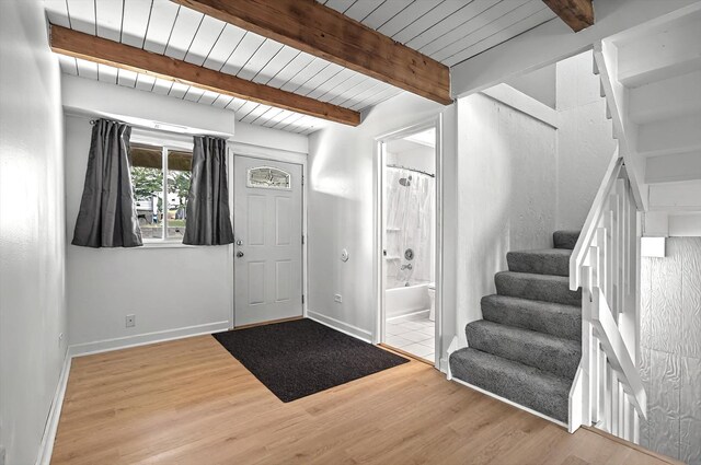 126 Cora Ave Unit D, Fox Lake, IL 60020 - entryway featuring wood finished floors, beam ceiling, stairs, and baseboards
