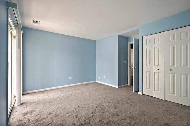 126 Cora Ave Unit D, Fox Lake, IL 60020 - unfurnished bedroom featuring carpet, baseboards, and a closet