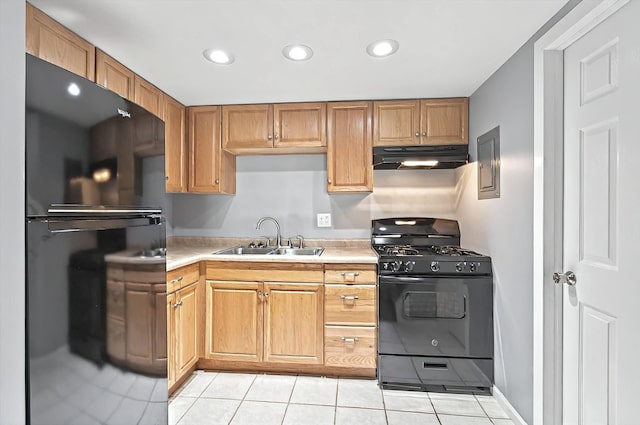126 Cora Ave Unit D, Fox Lake, IL 60020 - kitchen featuring black appliances, under cabinet range hood, a sink, light tile patterned floors, and light countertops