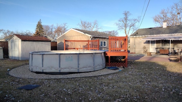 432 Rose St, Bensenville, IL 60106 - rear view of house with a wooden deck, an outdoor pool, and a chimney