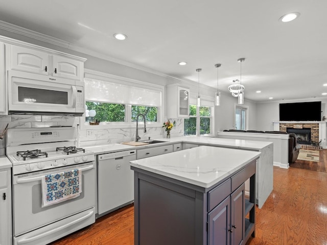 1520 Fordham Ct, Naperville, IL 60565 - kitchen featuring white appliances, a sink, a peninsula, white cabinets, and recessed lighting
