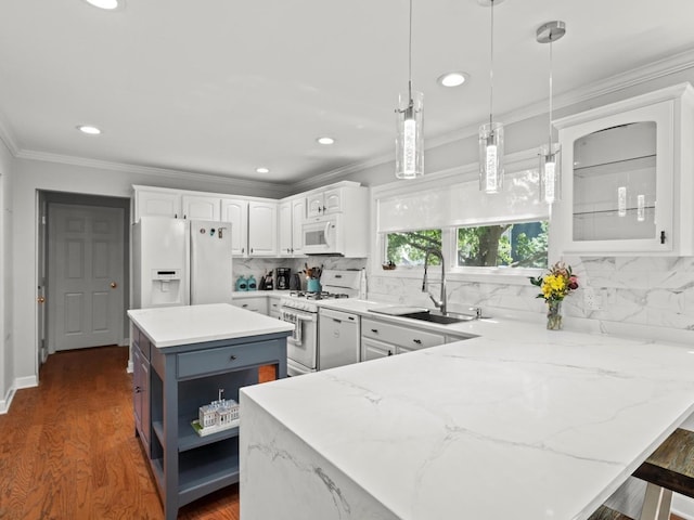 1520 Fordham Ct, Naperville, IL 60565 - kitchen featuring white appliances, a sink, a peninsula, white cabinetry, and tasteful backsplash