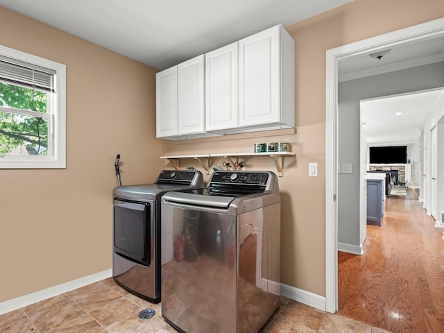 1520 Fordham Ct, Naperville, IL 60565 - laundry room with cabinet space, independent washer and dryer, baseboards, and crown molding