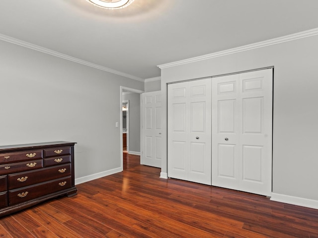 1520 Fordham Ct, Naperville, IL 60565 - unfurnished bedroom featuring ornamental molding, dark wood-type flooring, baseboards, and a closet