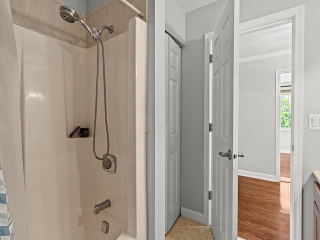 1520 Fordham Ct, Naperville, IL 60565 - bathroom with baseboards, shower / bath combo with shower curtain, and crown molding