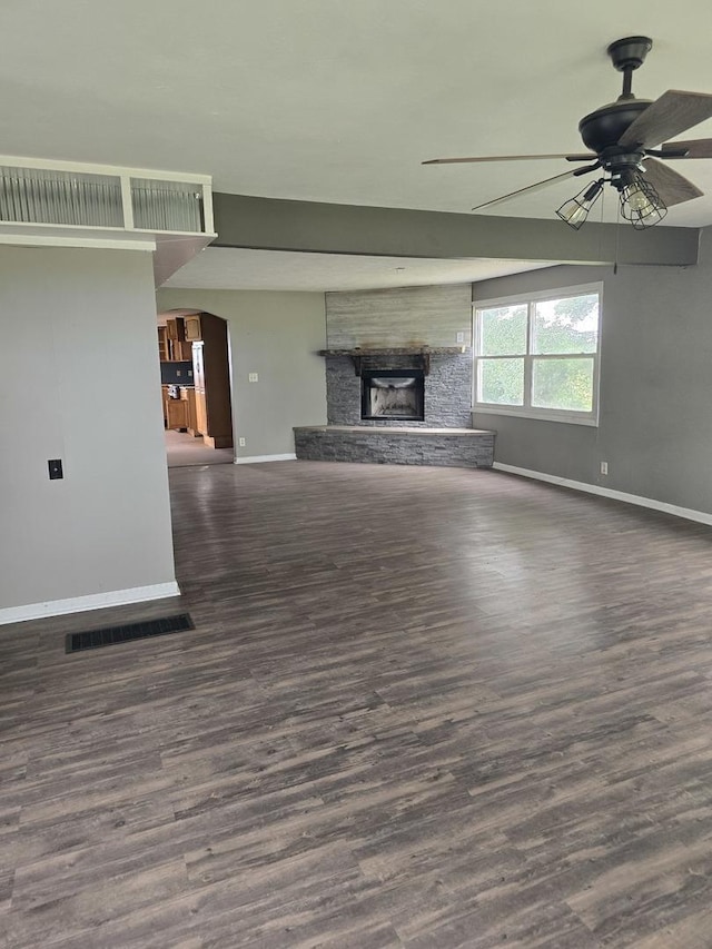 1350 N 2950 E Rd, Leroy, IL 61752 - unfurnished living room featuring baseboards, a ceiling fan, a fireplace, and wood finished floors