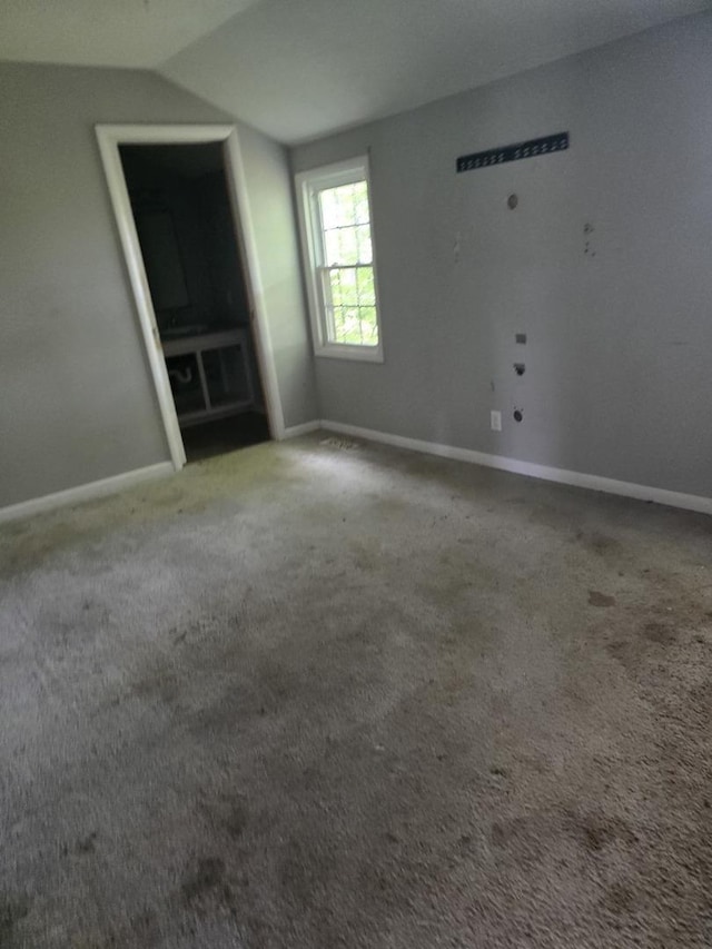 1350 N 2950 E Rd, Leroy, IL 61752 - carpeted spare room with baseboards and vaulted ceiling