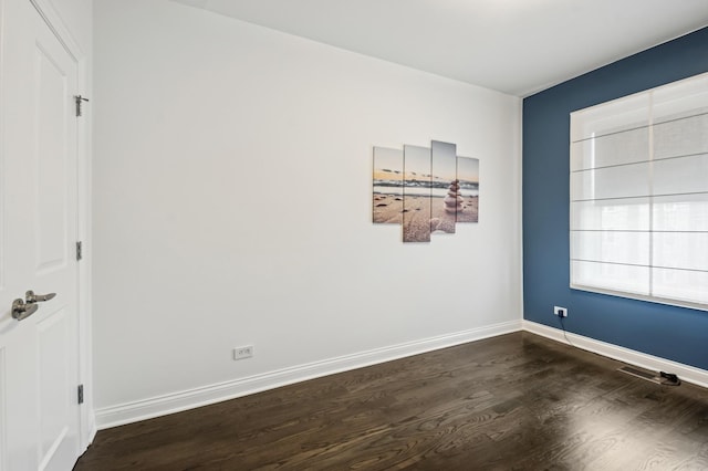 7223 N Hamilton Ave Unit A, Chicago, IL 60645 - empty room with dark wood finished floors and baseboards