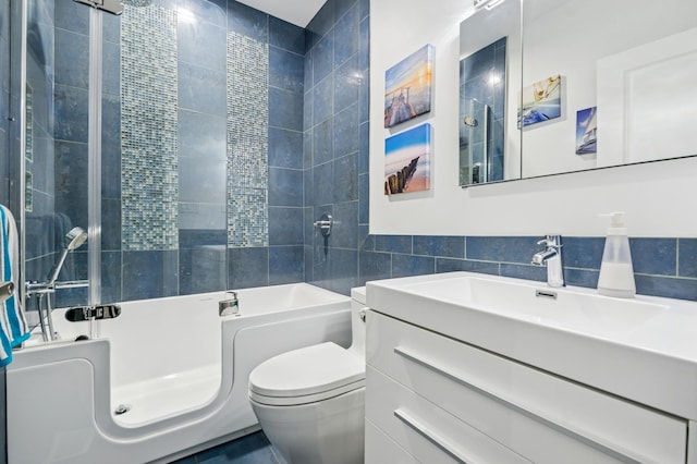 7223 N Hamilton Ave Unit A, Chicago, IL 60645 - full bath featuring toilet, tile walls, vanity, and bathtub / shower combination