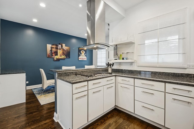 7223 N Hamilton Ave Unit A, Chicago, IL 60645 - kitchen with island exhaust hood, stainless steel gas stovetop, dark wood-style floors, white cabinets, and recessed lighting