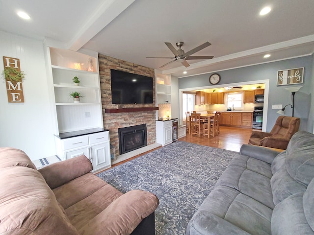 5831 W 109th St, Chicago Ridge, IL 60415 - living area featuring light wood-style floors, a ceiling fan, a stone fireplace, beamed ceiling, and recessed lighting