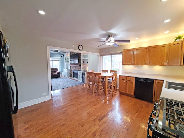 5831 W 109th St, Chicago Ridge, IL 60415 - kitchen with black appliances, ceiling fan, light wood finished floors, recessed lighting, and light countertops
