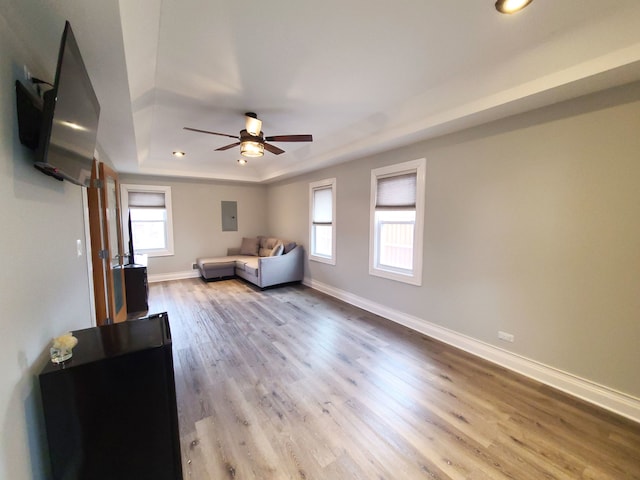 5831 W 109th St, Chicago Ridge, IL 60415 - living room featuring a tray ceiling, plenty of natural light, a ceiling fan, wood finished floors, and recessed lighting