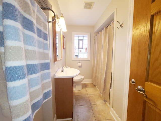 5831 W 109th St, Chicago Ridge, IL 60415 - full bathroom featuring vanity, toilet, tile patterned floors, and baseboards