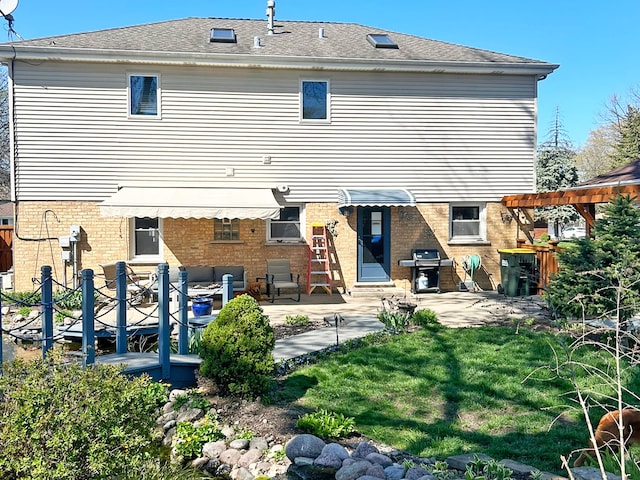 5831 W 109th St, Chicago Ridge, IL 60415 - rear view of property featuring brick siding, a patio, and a lawn
