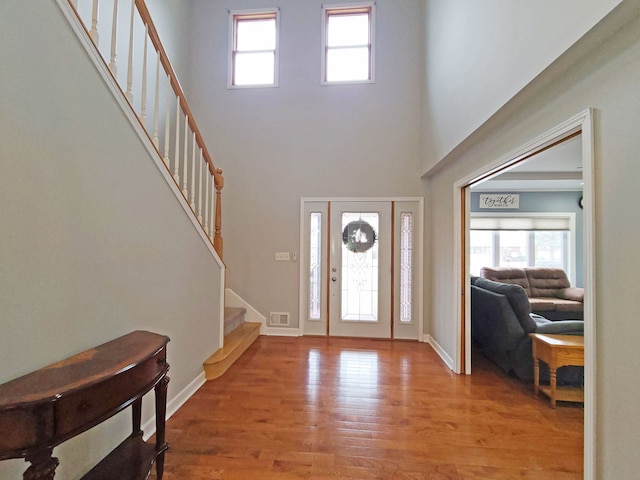 5831 W 109th St, Chicago Ridge, IL 60415 - entrance foyer with stairway, wood finished floors, a high ceiling, and baseboards